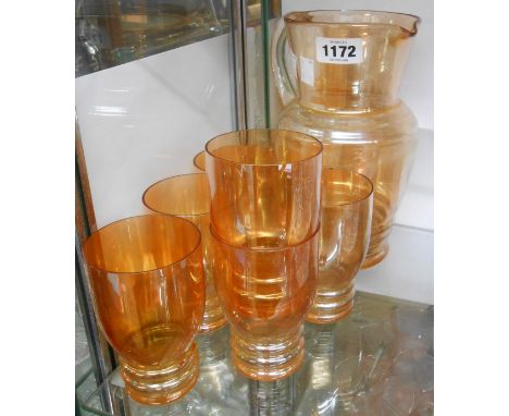 A vintage orange lustre glass lemonade set
