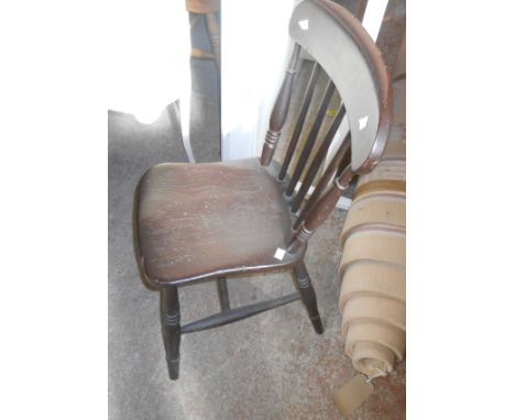 An antique stained wood stick back kitchen chair with moulded solid elm seat, set on ring turned supports