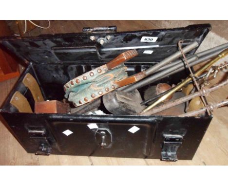An old metal toolbox containing a quantity of assorted tools and other items including blacksmith made pliers, old brass stud