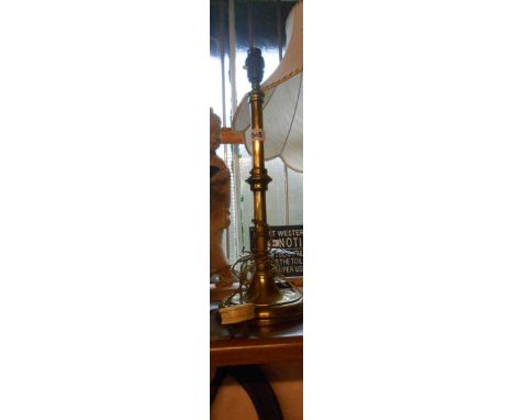 An old cast brass table lamp of tall candlestick from - sold with a modern brass table candlestick and a decorative oak mount