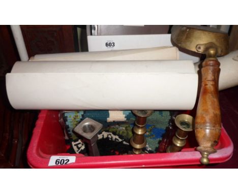 A crate containing a quantity of assorted collectable items including brass candlesticks, tapestry, etc.
