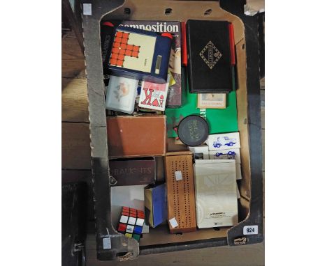 A box containing a quantity of vintage toys and games including dominoes, ludo, card games, die cast cars, etc.