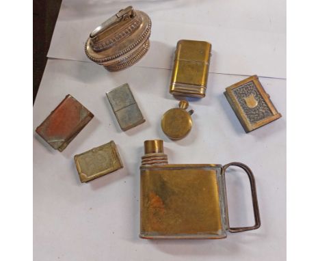 A bag containing a quantity of lighters including trench art examples - sold with a handheld wick oil lamp