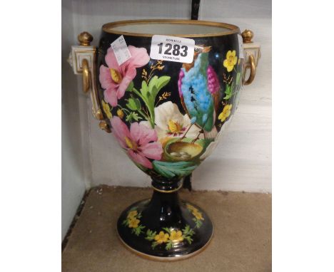 A late Victorian ceramic oil lamp base with hand painted bird and floral decoration on a black ground - no reservoir