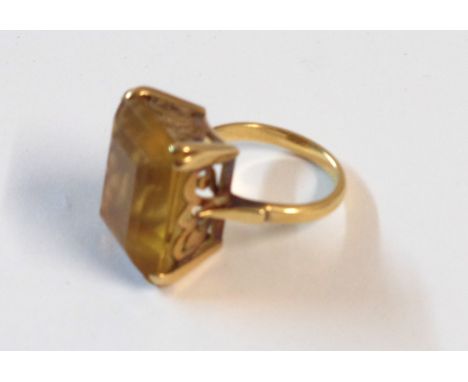 An unmarked yellow metal large citrine panel dress ring