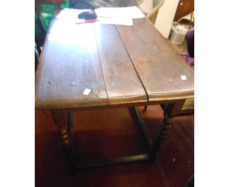 A 91cm antique oak side table with frieze drawer, set on a bobbin turned open stretcher base - age related warping and wear