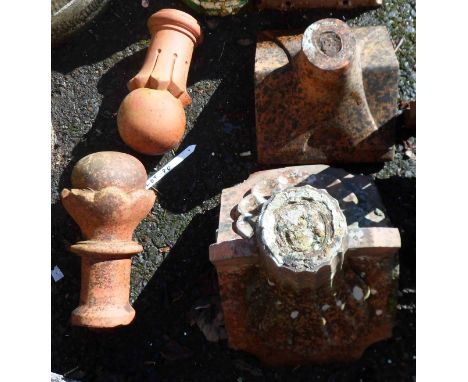 Two antique terracotta roof ridge tile finials - one marked for William Thomas &amp; Co. Ltd of Wellington, Somerset