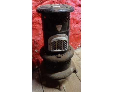 A vintage Valor paraffin greenhouse heater with black japanned body - rusty and handle missing
