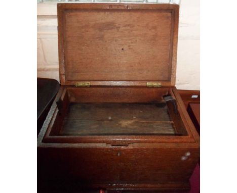 A small antique oak lift-top box with lift out tray