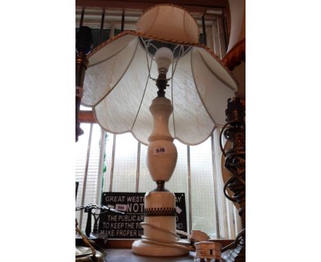 A vintage alabaster table lamp with brass fittings - sold with shade