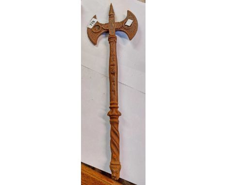 A cast iron decorative miniature double ended axe