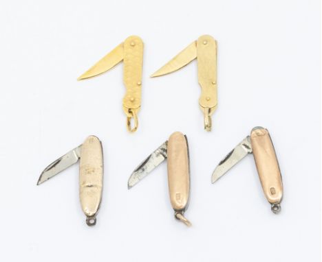 A collection of five mixed 20th century 9ct gold miniature pocket knives, two with similar diamond shaped engine turned decor