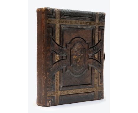 A late Victorian novelty photograph album music box, circa 1880-90, leather bound with gilt highlights, last page revealing g