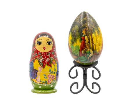 A 20th century painted Russian egg, depicting ladies, one playing flute, script mark in cyrillic to bottom an no. 94, on mode