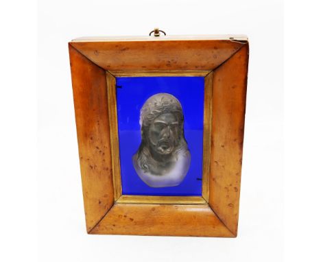 A 19th century moulded glass portrait bust of Christ, set on a clear blue glass background, Christ bust approx. 11.5cm long, 