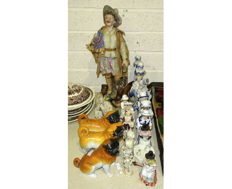 A Continental ceramic figure of a young man holding a bugle draped with the Union Jack, 53cm high, a pair of ceramic figural 