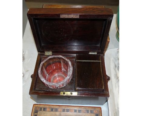 A 19th century rosewood tea caddy with interior cannister and glass mixing bowl, fitted with ring handles, 23cm wide, 13.5cm 