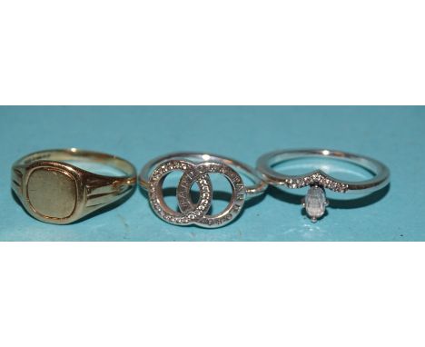 A 9ct gold signet ring, size M½, a silver "Pandora" ring and another gem-set silver ring, (3). 