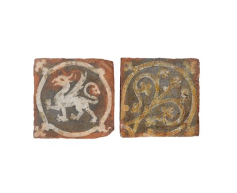 TWO DECORATIVE ENGLISH MEDIEVAL ENCAUSTIC FLOOR TILES (2). probably early 13th Century, the first depicting a white griffin i