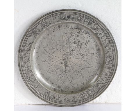 A GOOD AND DOCUMENTED QUEEN ANNE PEWTER MULTIPLE-REEDED WRIGGLEWORK PLATE, CIRCA 1700. The rim engraved ’THE GIFT IS SMALL TH
