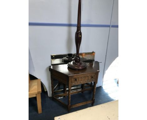 An oak single drawer side table and a mahogany standard lamp