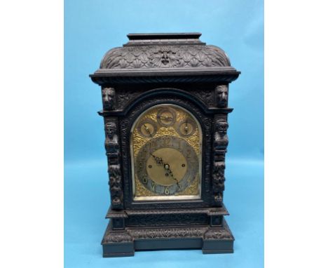 A large Victorian heavily carved oak bracket clock, with eight day movement, Whittington and Westminster chimes, three subsid