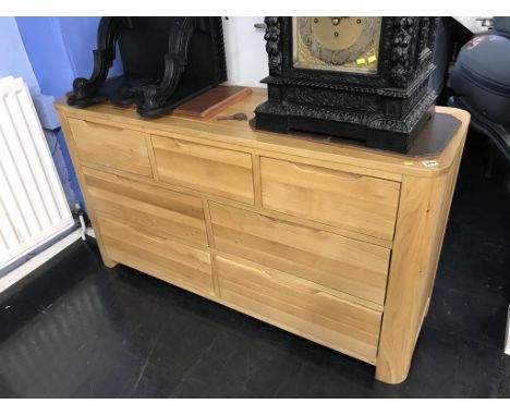 A modern light oak chest of seven drawers, 138cm wide