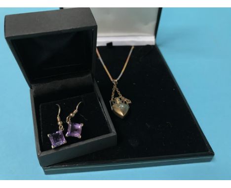 A 9ct gold chain and yellow metal pendant and a pair of earrings