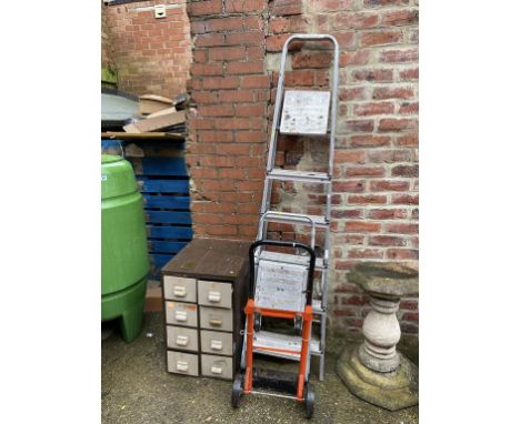 A filing cabinet, sack barrow and two pairs of step ladders