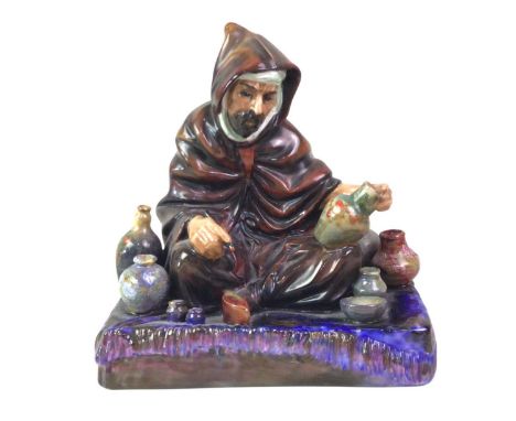 ROYAL DOULTON FIGURE OF THE POTTER, AND OTHER ITEMS including a wooden model elephant and vasesThe potter figure has a restor