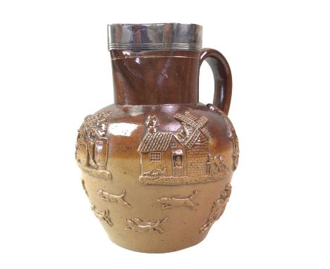 DOULTON BOWL, AND TWO JUGS  each decorated in relief with Dutch scenery and figures, the circular bowl with three lion handle