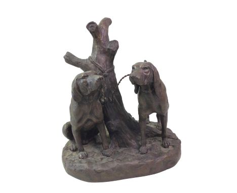 BRONZE GROUP, cast as two hunting dogs tethered to a tree stump35cm high