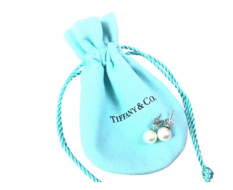 PAIR OF TIFFANY & CO PEARL STUD EARRINGS, ALONG WITH A PAIR OF CUFFLINKS with eighteen carat white gold posts, in box, along 