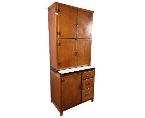 OAK VENEER KITCHEN CABINET, MANUFACTURED BY IDEAL CABINETS fitted with two pairs of doors over an enamel slide, above a cupbo
