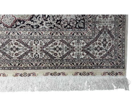 CHINESE SILK RUG, with central medallion and signature on a light ground182cm x 124cm