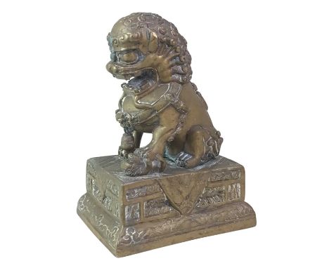 CHINESE BRASS FO DOG FIGURE, ALONG WITH A NEPALESE KUKRI the dog modelled seated and raised on a stepped rectangular base, al