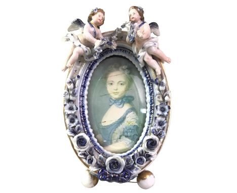 ANTIQUE GERMAN CERAMIC PICTURE FRAME, of rectangular form, white ceramic with blue details, marked 'R' to base, possibly Rex,