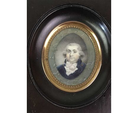 TWO PORTRAIT MINIATURES, each depicting an oval portrait painting on paper of a male and a female, in wood frames12cm and 11c