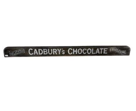 CADBURY'S CHOCOLATE REPRODUCTION SIGN, AND TWO OTHER REPRODUCTION SIGNS  both of elongated rectangular form, on brown backgro