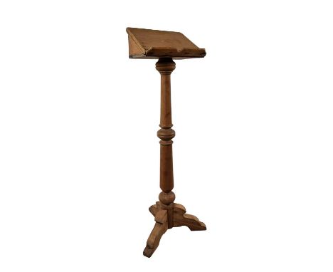 PITCH PINE LECTERN, on turned pillar and tripod base139cm high