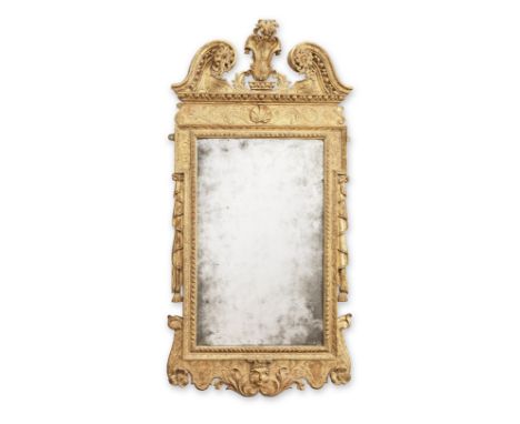 A George II giltwood and gilt gesso mirrorCirca 1730The rectangular bevelled plate within a gadroon moulded slip encompassed 