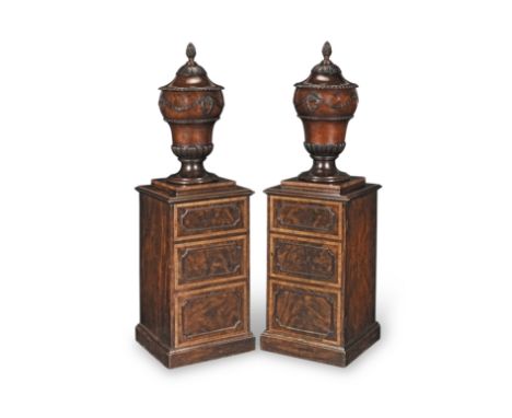 A pair of George III mahogany and kingwood crossbanded urns and pedestalsCirca 1780, of Gillows qualityWith boxwood stringing