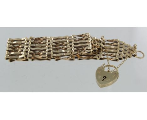 9ct yellow gold six row gate link bracelet with heart padlock clasp and safety chain, weight 23.3g