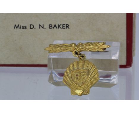 9ct gold BP pin badge for long service. Approx 5.5g