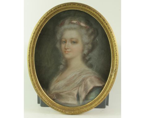 Pastel. An oval pastel portrait depicting a blue eyed woman, circa early 20th Century, unsigned, contemporary framed &amp; gl