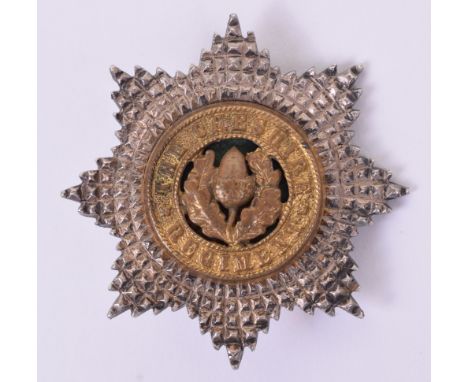 The Cheshire Regiment Officers Cap Badge, two piece silver gilt and enamel example having single repaired lug to the reverse.