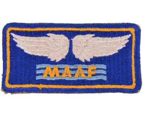 WW2 USAAF Mediterranean Allied Air Force Patch, American made example with white wings above MAAF on blue bars. Good conditio