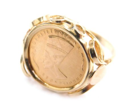 A 20thC Nefretiti Aegyptiorum Egyptian yellow metal coin ring, on a plain partially pierced shank, marked 585, size L, 3.1g. 