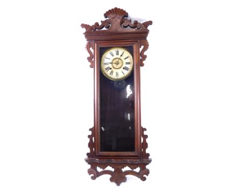 A late 19thC American wall clock, in walnut case, with carved brackets, etc., the paper dial stamped for The Ansonia Clock Co