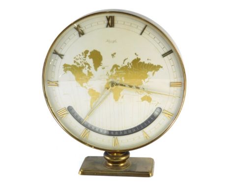 A 1970s Kienzle world time mantel clock, with Roman numerals, Arabic centre column and a world stencilled circular face, 25cm
